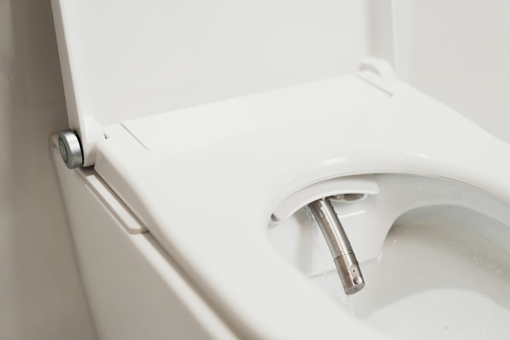 Nærbilde av dysa til Clean Comfort spyl- og tørketoalett.